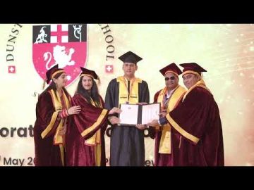 Recieving Honorary Doctorate award from Dunster Business School Switzerland